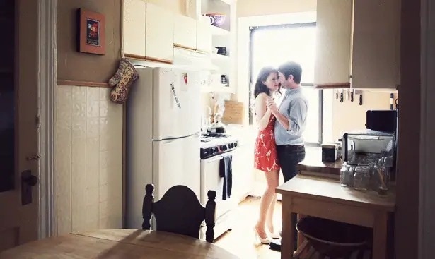 couple dancing at the kitchen