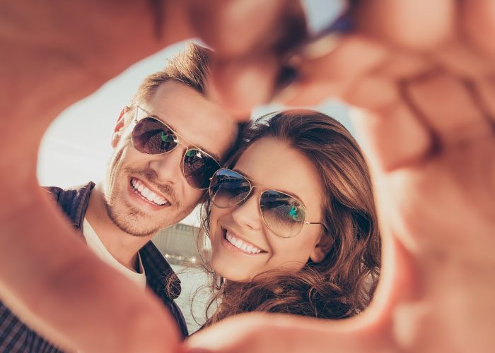 happy couple in sunglasses