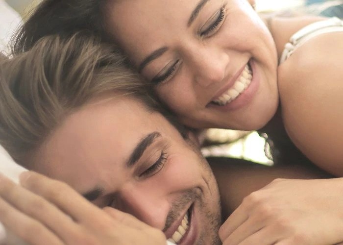 happy couple in bed